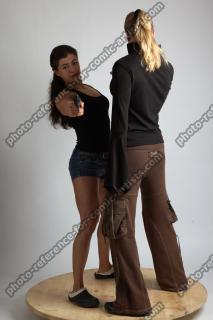 2021 01 OXANA AND XENIA STANDING POSE WITH GUNS 2 (2)